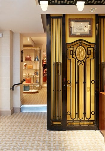 The lift in the Hermès boutique in Paris, which dates back to 1923, has ornate wrought iron decoration that was popular at the time.