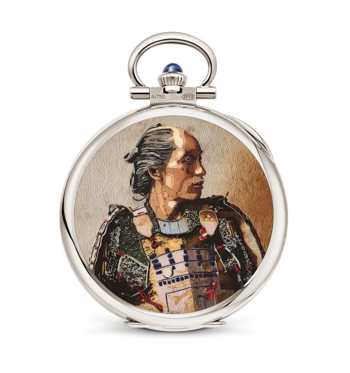 This “Portrait of a Samurai” pocket watch (995/131G-001) is among the exceptional watches created for this grand exhibition. It stands out as one of the most complex decorations in wood marquetry ever created by Patek Philippe. The marquetry artisan cut and assembled an incredible 800 veneers and 200 tiny inlays spanning a palette of 53 species of wood in a multitude of colours, textures and veining.