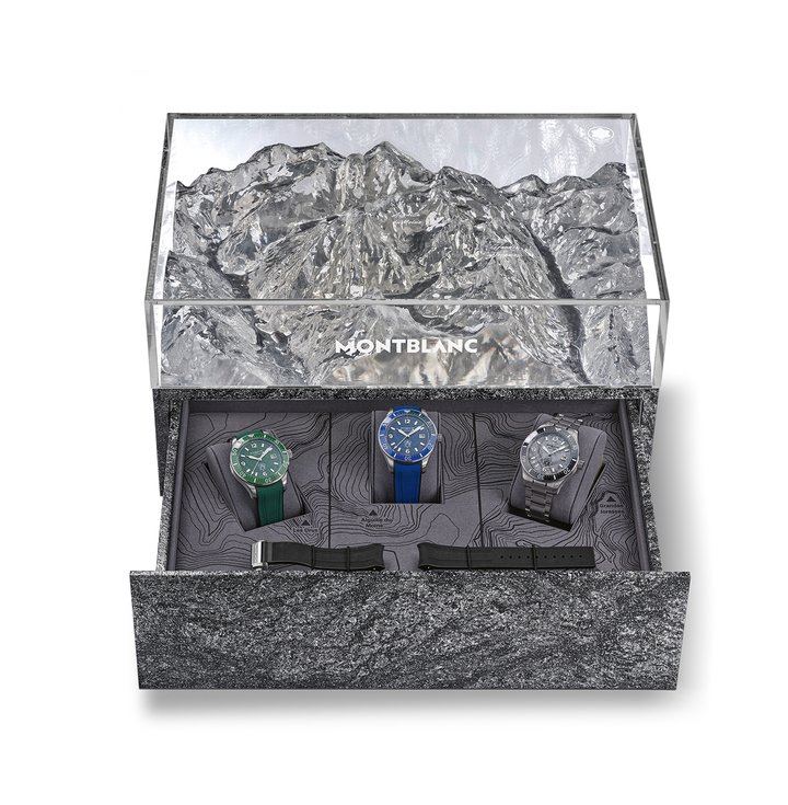 Limited edition presentation box with granite base and plexiglas cover decorated with a relief depiction of the Mont-Blanc massif, housing three Montblanc Iced Sea Automatic Date models. The caseback of each watch features a laser engraving in colour, representing a different view of Mont Blanc: the Aiguille du Moine (blue version), Les Drus (green), and Les Grandes Jorasses (grey).