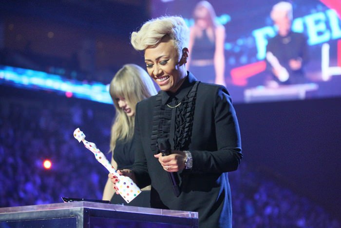 Emeli Sandé receiving her price at the BRIT Awards 2013