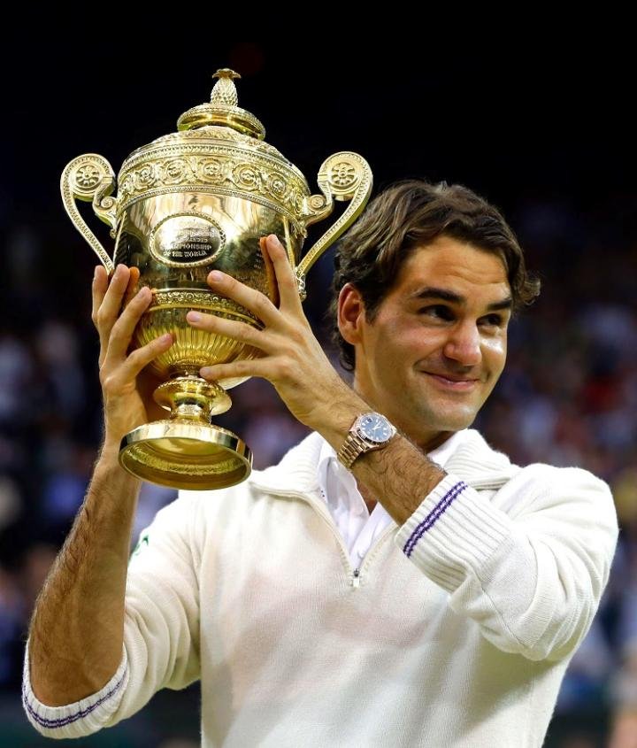Roger Federer, his Rolex Day-Date II, and his Wimbledon 2012 champion's trophy