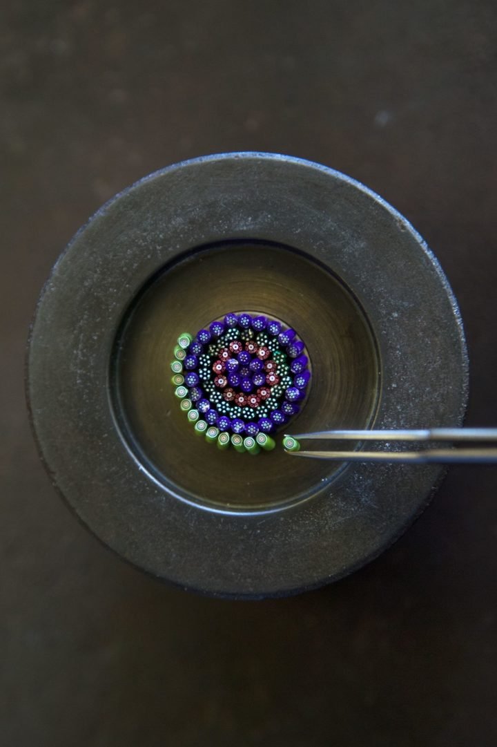 For the Arceau Millefiori (2015), preparation of a millefiori crystal dial from a multitude of crystal “bonbons”, handcrafted at Cristalleries Royales de Saint-Louis using a nineteenth-century paperweight technique. Once assembled, this colourful bouquet will be captured in a drop of translucent crystal to create the illusion of a bed of flowers.
