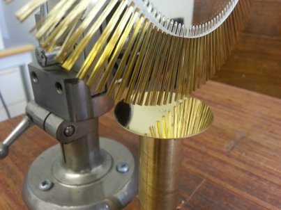 The special radial finishing tool used on the gold dial