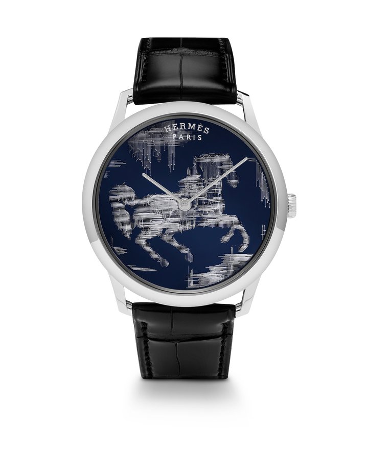 Slim d'Hermès Cheval Ikat (2019). Originally designed for the electronics industry, wire-ball bonding creates a relief pattern by fusing gold threads, like embroidery threads, to the surface of the dial.