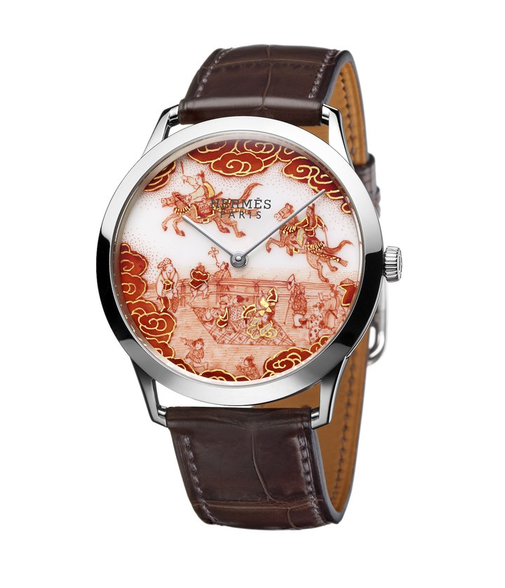 Slim d'Hermès Koma Kurabe (2015). On a porcelain dial crafted by Manufacture de Sèvres, master artist Buzan Fukushima honours the millennial-old Koma Kurabe horse race which takes place once a year at the Kamigamo Shrine (built 678) in Kyoto. He is one of the rare artisans to perpetuate the Aka-e technique of porcelain painting finished with a fine layer of gold.