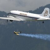 Yves Rossy flying in formation with the Breitling DC-3
