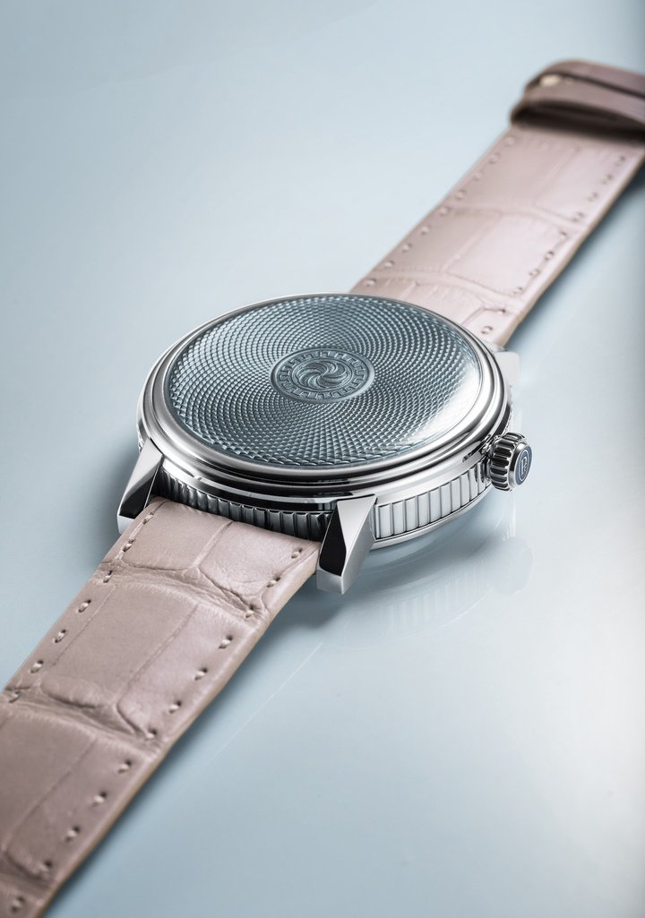 Upturning convention, the L'Armoriale minute repeater reserves its front for a hand-guilloché motif under translucent Grand Feu enamel. The time display is on the reverse, for only the wearer to see, where rose gold hands circle a simple time scale around the periphery of a Guatemalan white jade disc.