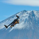 Breitling's jet man Yves Rossy against the backdrop of Mount Fuji
