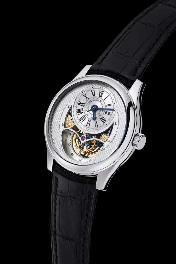 Jean Daniel Nicolas Two-Minute Tourbillon. Hour hand, minute hand, seconds indicated by the tourbillon. Power reserve of more than 60 hours shown by an indicator hand.