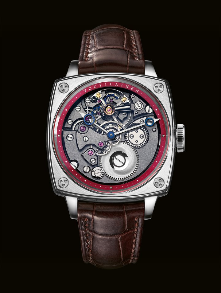 Voutilainen KV20i Reversed CS: Voutilainen's rare inverted movement, with its two direct-impulse escape wheels and single-arm balance bridge, is on full show on the dial side of the KV20i Reversed CS, with its display of hours and minutes. The workshop's trademark hand-guilloché decoration has also been “reversed”, appearing on the chapter ring and subsidiary seconds on the back, in a striking, almost provocative, cherry red. The 39mm case housing the movement adopts a bold cushion shape. Finished with alternating brushed and polished surfaces, it extends into short, curved lugs. This contemporary form is a direct descendant of the Voutilainen TP1 pocket watch for Only Watch 2019, created by Kari Voutilainen with his daughter Venla – who convinced him to add bright orange accents. A forerunner to this particularly vibrant crimson.