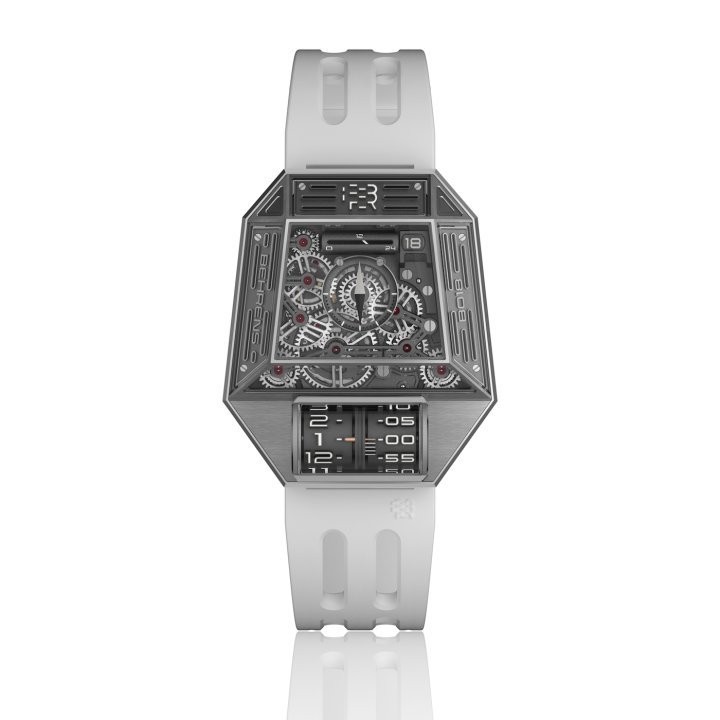 The inspiration for the new Orion One automatic wristwatch, featuring Behrens' classic “time display on a circular axis” concept, came from imagining the “Mothership” that aliens might use for travelling to Earth. The case features some 40 shaped and polished facets. Thanks to a newly designed and patented lever-type winding/time setting mechanism, the crown has been replaced by a hidden lever.