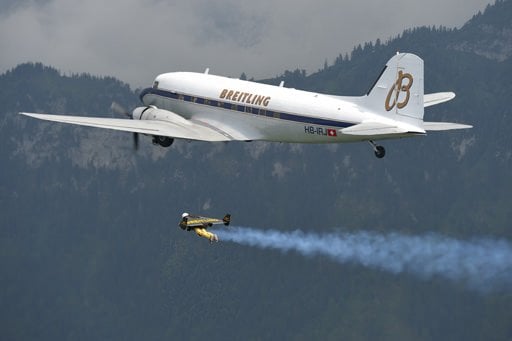Yves Rossy flying in formation with the Breitling DC-3