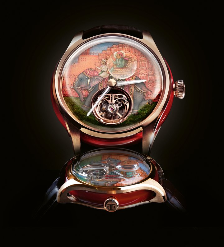 Powering Jalsa is Titan's in-house Calibre 7TH2, a flying tourbillon movement comprising 144 components and 14 jewels. The flying tourbillon features a customised rotating cage representing the ‘T' of Titan. The choice of red agate extends beyond ornamentation. Traditionally associated with protection and prosperity in Rajasthan's royal history, the stone is integrated into both the bridges and the 18k rose gold skeleton case. Attached as a counterweight to the minutes hand, a sapphire lens opens a rotating window onto the miniature, revealing as time goes by the delicate details of the royal procession in front of the Hawa Mahal.