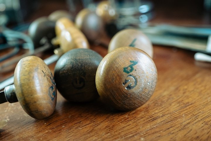 A wide variety of chisels and blades, essential tools for engravers.