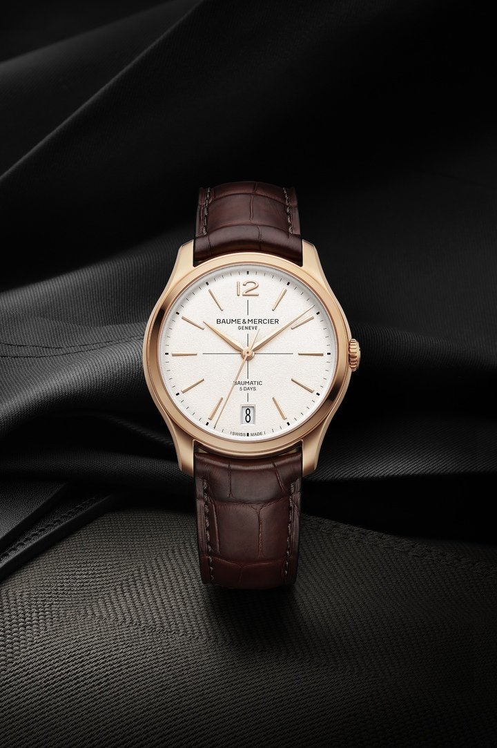 Carrying forward the pure essence of 1950s design and positioned at the high end of Baume & Mercier's offering, the new Clifton Baumatic models, which debuted at Watches and Wonders 2025, are a first taste of the full collection launching in September. Proportions and finishing of the 39mm case have been carefully reworked, including a slimmer 11.5mm profile. Arabic numerals return at 12 o'clock alongside longer indices. The date is shown in a large aperture at 6 o'clock and features a new font design. The domed sapphire crystal shouts out to the model that inspired the collection, while the more slender crown has been better integrated.