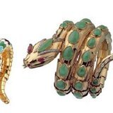 From Left to Right: Serpenti bracelet-watch in yellow gold and polychrome enamel. The scales are decorated with white, black, green and turquoise enamel, the head is with pear-shaped emerald eyes concealing a circular dial, ca 1965 - Serpenti bracelet in yellow gold decorated with jades, rubies and diamonds, ca 1968 - Serpenti jeweller y watch pink gold double coil bracelet set with 385 brilliant cut diamonds (4,12 ct) and black sapphire dial set with 33 diamonds.