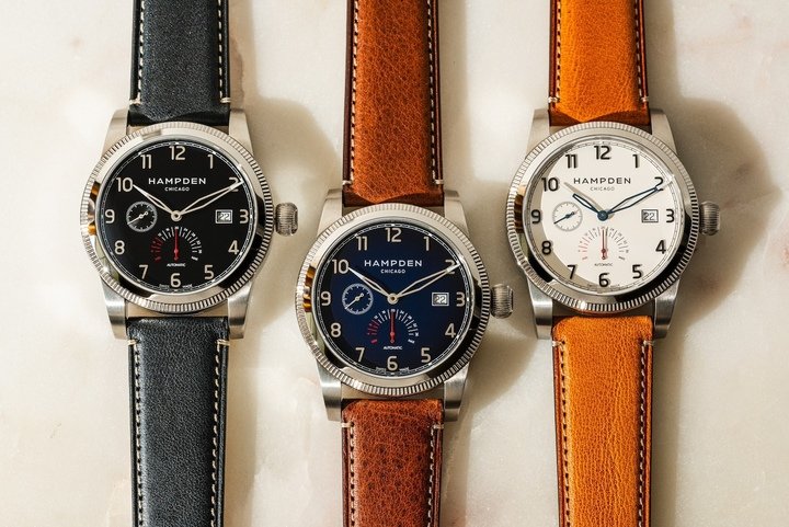 The Model 1 Sullivan, Hampden's flagship automatic, shown in all three dial colors: Carbon, Navy, and Parchment. Each features a Swiss Made Sellita movement, 38-hour power reserve display, and the patented Casecap® system for interchangeable caseback personalization.