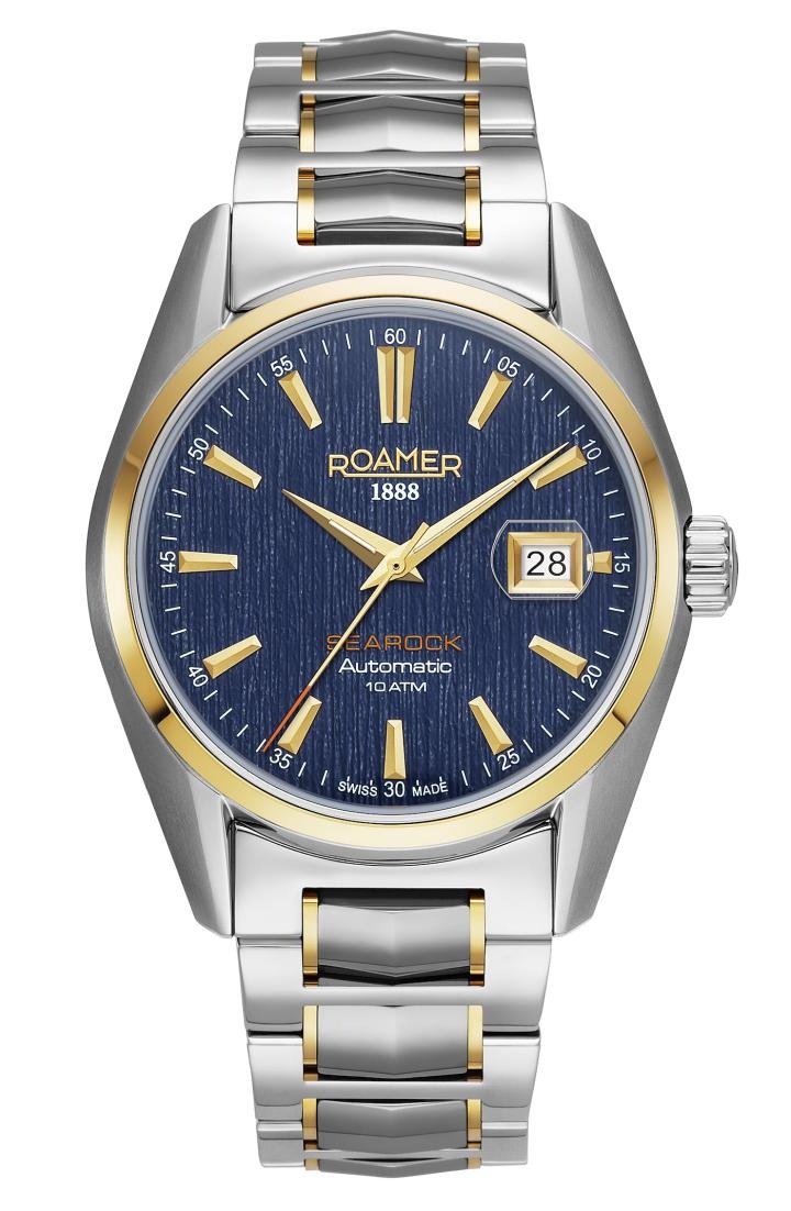 The Roamer Searock II is water resistant to 10 ATM and comes in a choice of two finishes. In addition to three models in gold, green and blue with a sunburst finish, there is a choice of a brushed, textured dial in silver, black or blue. All watches are worn on a stainless steel bracelet with solid butterfly clasp.