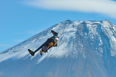 Breitling's jet man Yves Rossy against the backdrop of Mount Fuji