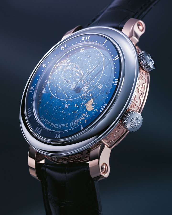 The Ref. 5102 Sky Moon by Patek Philippe, released in 2002, is a follow-up to the Star Calibre 2000, one of the most complex pocket watches of its time. For the very first time on a watch, its 21 complications included the configuration of the night sky, including the apparent movement of the stars, the position of the Moon, the lunar cycle and moon phases. Six months later, the Sky Moon Tourbillon was released, in wristwatch format, equipped with the same miniaturised astronomical module, placed on the back of the watch. With the Ref. 5102, the sky takes over the entire dial. This magnificent depiction of the sky displays standard hours and minutes (mean solar time), a sky chart, the time Sirius crosses the meridian, the time the Moon crosses the meridian, angular motion of the Moon and phases of the Moon. This miniature cosmos is as precise as it is poetic, and comes in a reduced diameter of 43.1 mm with a height of 9.78 mm. The first Ref. 5102 in a hand-engraved rose gold case with platinum bezel. The Ref. 6104 from 2010, a gem-set version with the addition of the date on the periphery of the dial, indicated by a hand with a crescent Moon. The Ref. 6102 of 2011, unset version with date.