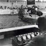Longines has been partner in equestrian sports since 1912. Longines timing devices at a horse show in La Chaux-de-Fonds in 1955.