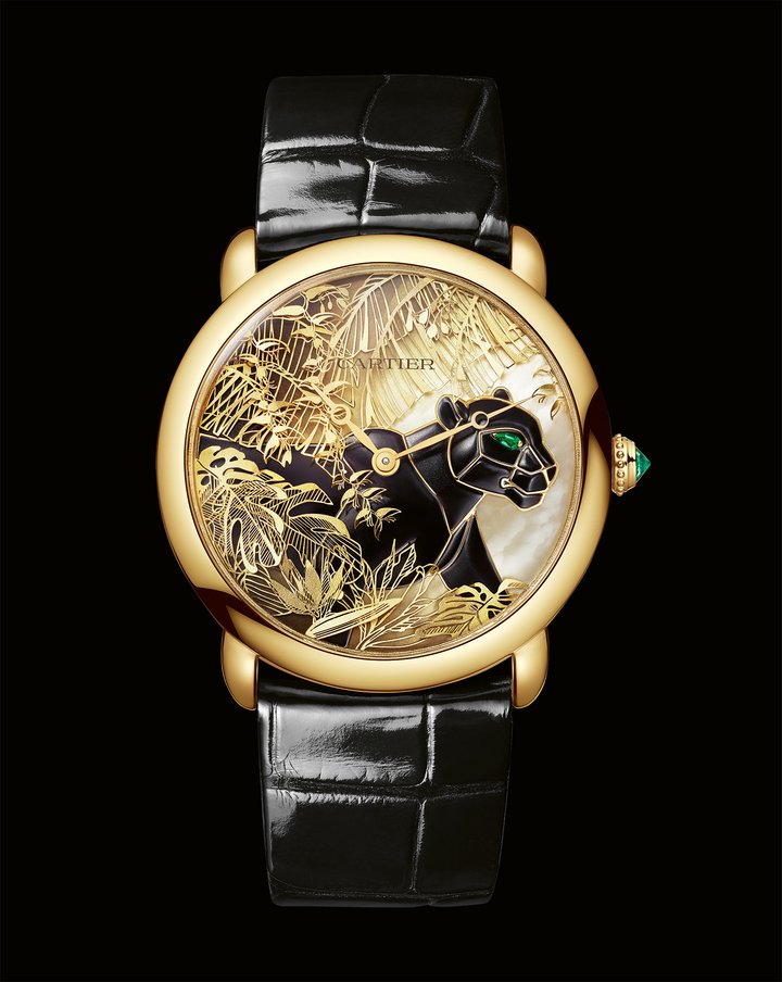 Ronde Louis Cartier Panthère Métiers d'Art (2025) whose white lacquer and mother-of-pearl dial portrays a black lacquered mother-of-pearl panther among sculpted “paillon” leaves