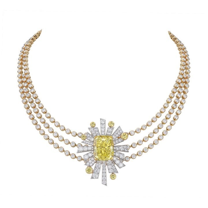 The Soleil 19 août necklace is set with a 22.10-carat, cushion-cut, fancy vivid yellow diamond at the centre of a detachable motif that transforms into a ring.