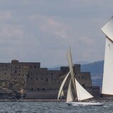 Classic yachts sailing across the harbour of Naples in the Vele d'Epoca