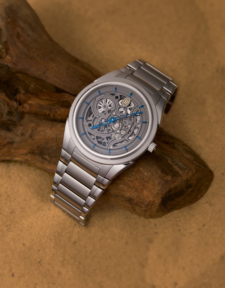 PRJKT8 partnered with Parmigiani Fleurier on a special edition of the Tonda PF Skeleton, limited to just 8 pieces worldwide. The watch showcases flame-blued indices and hands, set against the open-worked PF777 movement in a 40mm stainless steel case with a platinum bezel and skeletonised dial.