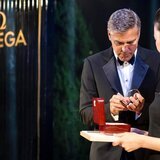 George Clooney autographed the strap and the presentation box of the Omega De Ville Hour Vision Annual Calendar he had been wearing.