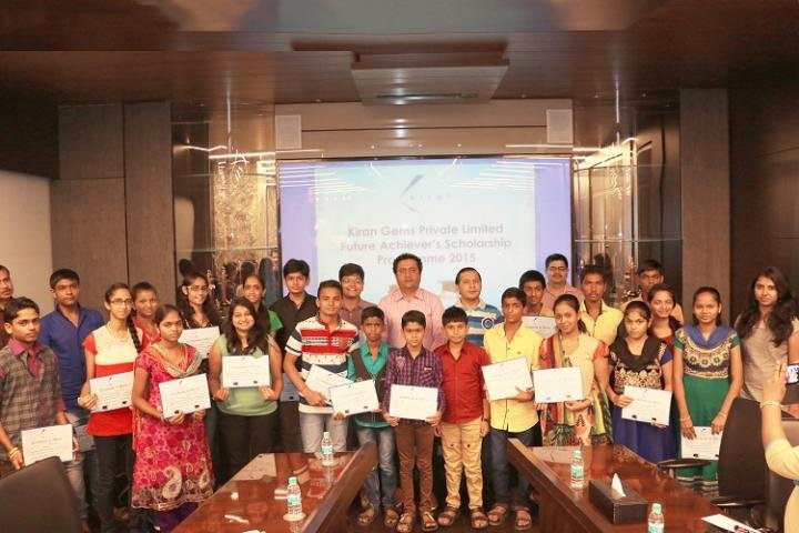 Kiran Gems' Director, Mr. Dinesh Lakhani, with Scholarship Winners At Future Achiever's Scholarship Programme 2015 Organised By The Diamantaire