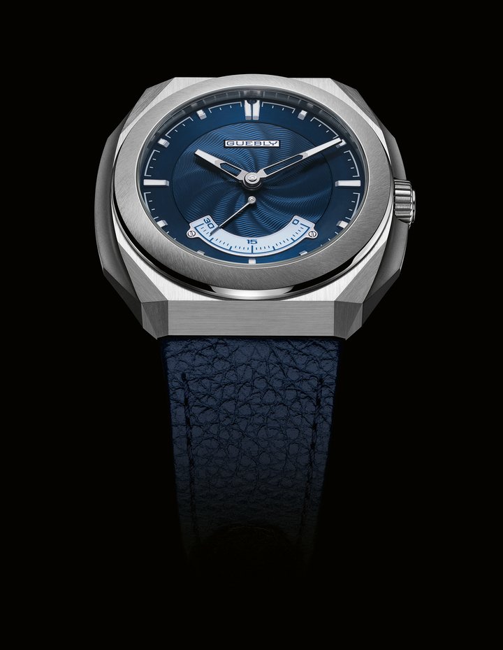 The CH1 Rétrograde's dial showcases artisanal excellence at its purest. Hand-guilloché on a 925 sterling silver base, it reveals a spiral motif inspired by wind-shaped dunes – offering subtle, dynamic depth. Light dances across its surface, accentuating each undulation with finesse. The retrograde appliqué in white gold features champlevé Grand Feu enamel by Maëlle Constant, a specialist in this age-old technique. 