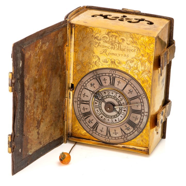 Among the ten clocks that will be featured is LOT 284, a Franco Villacroce Roma 1755 Table Clock in the form of a book, another unique piece in this collection as object shaped clocks are extremely rare. This extraordinary piece is put forward by the same seller as Lot 257, testament to his expertise.