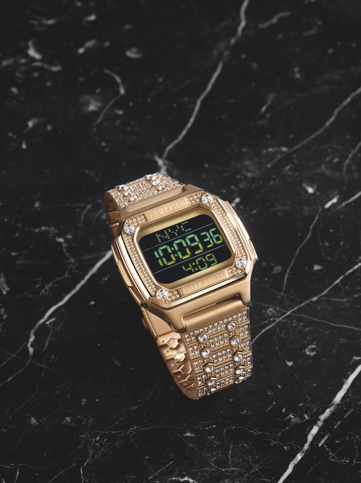 Philipp Plein's Hyper $hock is a digital timepiece available in sparkly yellow gold or stainless-steel versions, with a pave of white crystals covering the top ring and bracelet links.