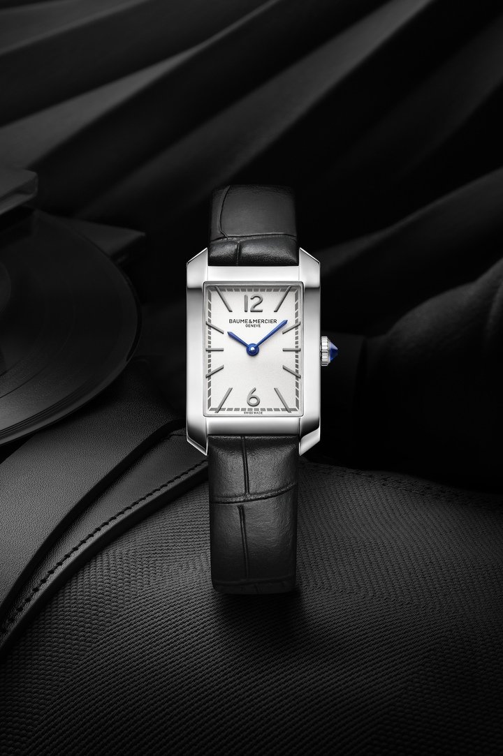 Introduced in 1994, the Hampton collection has been redesigned in a refined 35 x 22.2mm case that measures just 6.92mm high. The silver opaline dial carries rhodium-plated Arabic numerals at 12 and 6 o'clock, rhodium-plated indices, blue sword-shaped hands and a grey minute track. The quartz movement has an autonomy of six years.