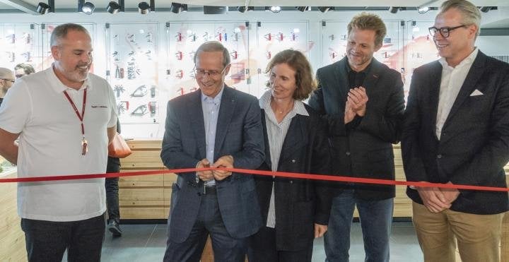 Carl Elsener Jr. (centre), at the opening of the new store. He represents the fourth generation running Victorinox. 
