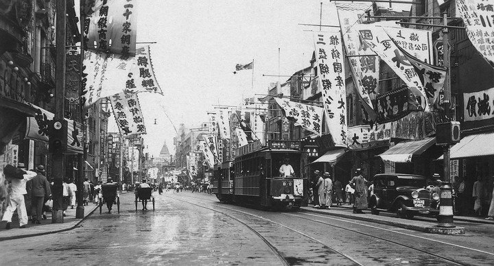 Shanghai's Nanking Road, with a British company tram heading to Bubbling Well terminus, 1920s. Tissot Museum Collection.