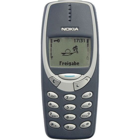 Nokia 3310 with the clock on the top right corner of the screen