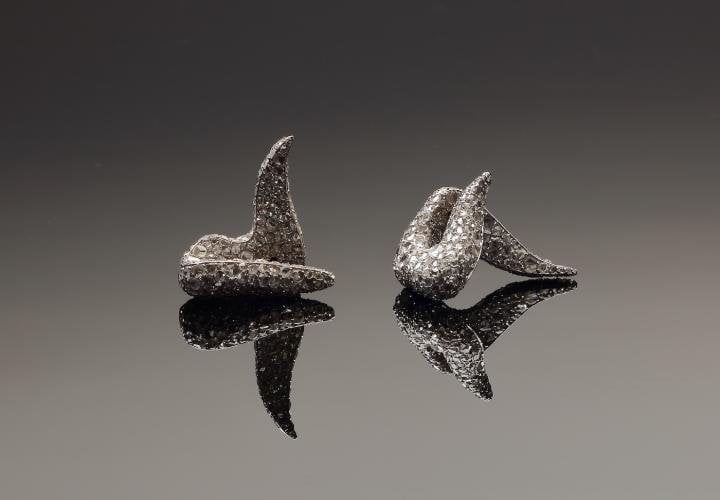 Pair of Debusigne earrings set with rose cut diamonds
