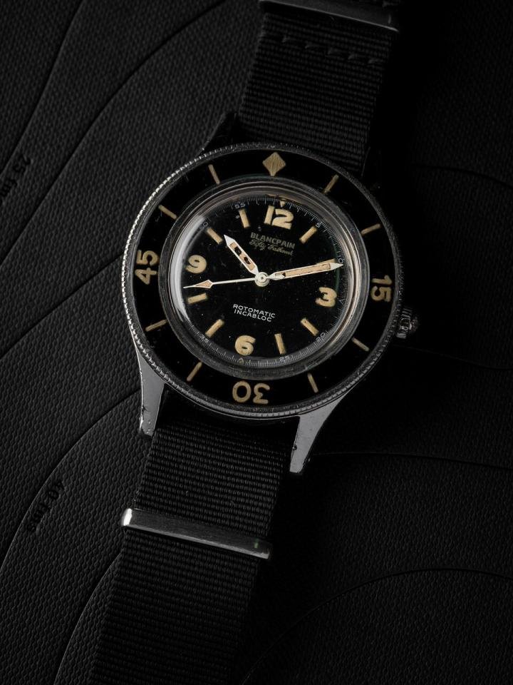 A Blancpain Fifty Fathoms. The ISO 6425 standard launched in 1996 took as inspiration some of the specifications and requirements of the Blancpain Fifty Fathoms 