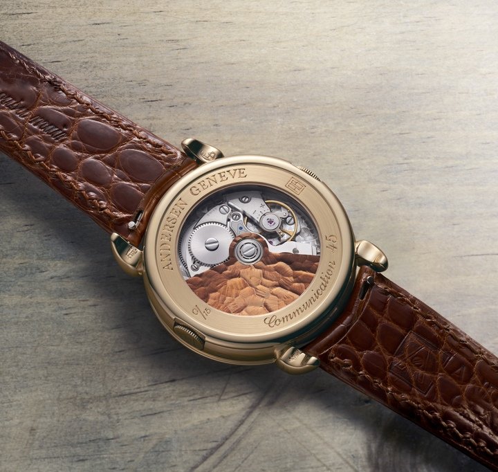 Andersen Genève marks its 45th anniversary with the Communication 45, a limited edition that celebrates the worldtimer's importance for the brand (top, shown next to the original from 1990). Since its creation, the worldtime module has been constantly refined and now measures just 0.9mm thick. Like the dial, the oscillating weight is 21k BlueGold in a cognac shade. The contrast with the frosted texture of the bridges and plates highlights the chamfering.