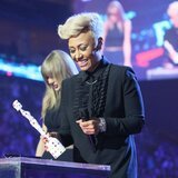 Emeli Sandé receiving her price at the BRIT Awards 2013