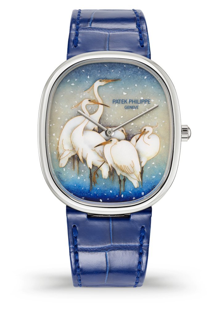 Patek Philippe Golden Ellipse White Egrets wristwatch ref. 5738/50G-026 from the 2023 Rare Handcrafts collection, exhibited for the first time in April 2023 in the Geneva boutique. For this interpretation of a 1920s Japanese print, Anita Porchet has used the cloisonné technique not to separate the different colours but to accentuate the contours of the egrets, huddled amidst a flurry of remarkably realistic snowflakes.