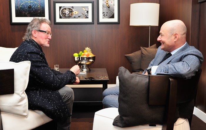 John Helliwell and Georges Kern, CEO of IWC Schaffhausen at the IWC booth during the Salon International de la Haute Horlogerie (SIHH) 2014.