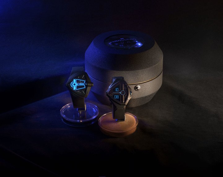 A button on the Ventura Bright activates glowing blue lines that mirror the dial for the Desert Watch featured in Dune: Part Two. The Ventura Edge has a matte black PVD-coated angular case while the blue digital display replicates the relief elements on the film's prop watch.