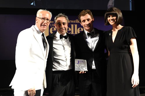 Bremont co-founders Giles and Nick English (centre) pick up their awards