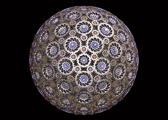 Here is a set of 242 interlocking bevel gears arranged to rotate freely along the surface of a sphere. This sphere is composed of 12 blue gears with 25 teeth each, 30 yellow gears with 30 teeth each, 60 orange gears with 14 teeth each, and 140 small red gears with 12 teeth each." – Paul Nylander, bugman123.com