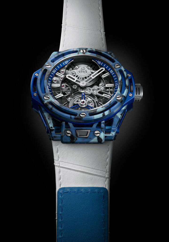 There are three versions of the Hublot Big Bang Tourbillon Novak Djokovic GOAT Edition, reflecting the familiar colors of tennis's three playing surfaces, and each variant is issued in a numbered sequence tracking his victories on each surface. Accordingly, there will be 72 pieces in blue, symbolizing his hard-court wins; 21 in orange for his clay-court victories; and, making it the most exclusive, eight in green for his triumphs on grass. The 101 watches are individually numbered but not limited editions.