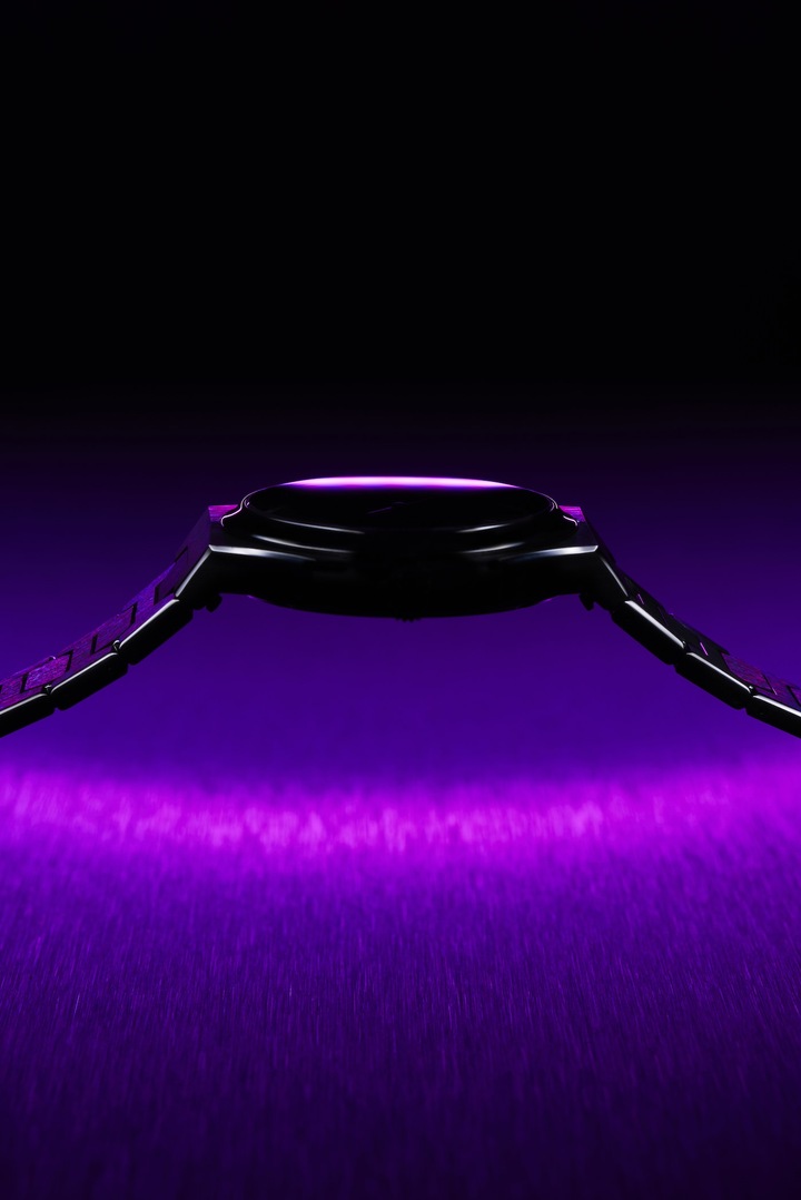 The purple of the dial is complemented by the darker shades of the grade 5 titanium case and bracelet.