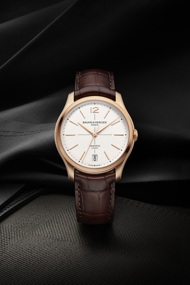 Carrying forward the pure essence of 1950s design and positioned at the high end of Baume & Mercier's offering, the new Clifton Baumatic models, which debuted at Watches and Wonders 2025, are a first taste of the full collection launching in September. Proportions and finishing of the 39mm case have been carefully reworked, including a slimmer 11.5mm profile. Arabic numerals return at 12 o'clock alongside longer indices. The date is shown in a large aperture at 6 o'clock and features a new font design. The domed sapphire crystal shouts out to the model that inspired the collection, while the more slender crown has been better integrated.